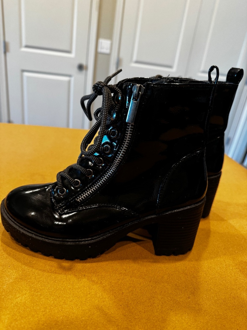 Black heeled shiny lace boots